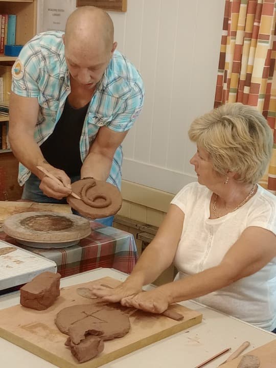 art instructor guiding students